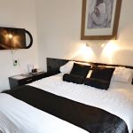 Double or Twin en-suite room with large window overlooking free car parking bays.