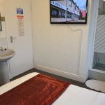 Double room (not en-suite) with own private shower, overlooking the free parking bays to the west of the Guest House.